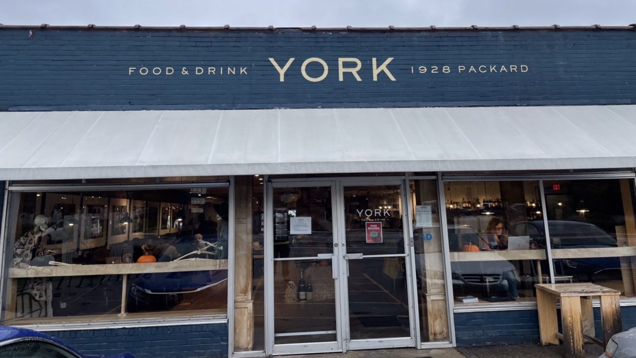 The front of York Ann Arbor. A blue building with “YORK” over its white awning and glass double doors.
